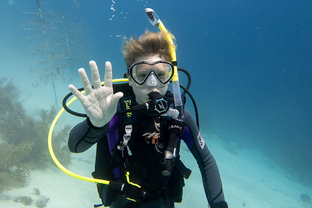 14 year old junior advanced open water diver in curacao enjoying an amazing trip with his parents